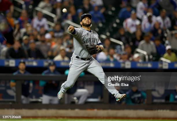 Eugenio Suarez of the Seattle Mariners fields a sacrifice bunt by Brandon Nimmo of the New York Mets in the fifth inning at Citi Field on May 13,...