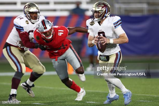 Shae Patterson of Michigan Panthers runs with the ball as Greg Reaves of Tampa Bay Bandits tries to break free from Josh Dunlop of Michigan Panthers...