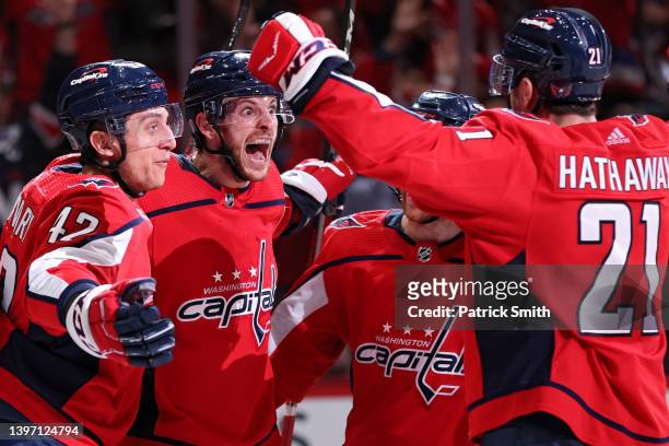 Nic Dowd of the Washington Capitals celebrates his goal with teammates against the Florida Panthers during the second period in Game Six of the First...