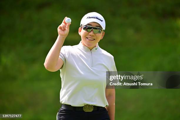 Jiyai Shin of South Korea poses after her hole-in-one on the 2nd green during the second round of the Hoken no Madoguchi Ladies at Fukuoka Country...