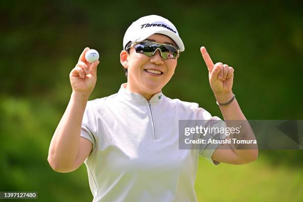Jiyai Shin of South Korea poses after her hole-in-one on the 2nd green during the second round of the Hoken no Madoguchi Ladies at Fukuoka Country...