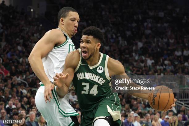 Giannis Antetokounmpo of the Milwaukee Bucks drives to the basket against Grant Williams of the Boston Celtics during the third quarter in Game Six...