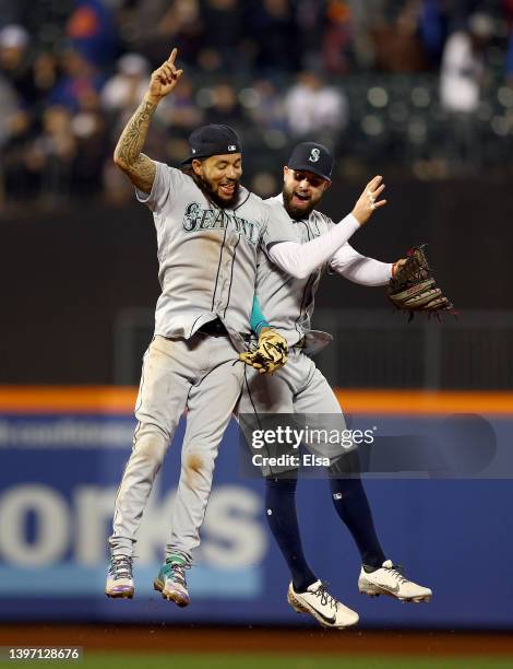 Crawford and Jesse Winker of the Seattle Mariners celebrate the win over the New York Mets at Citi Field on May 13, 2022 in the Flushing neighborhood...