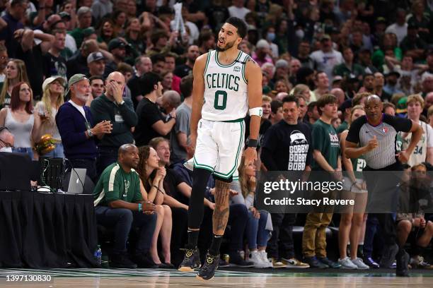 Jayson Tatum of the Boston Celtics reacts to a three point shot against the Milwaukee Bucks during the second half of Game Six of the Eastern...