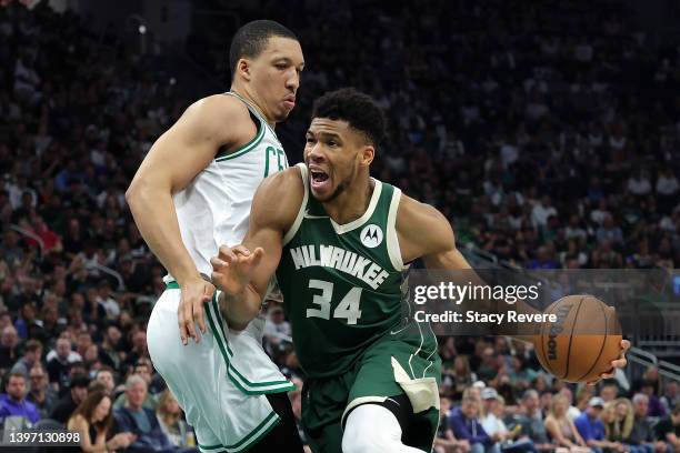 Giannis Antetokounmpo of the Milwaukee Bucks drives around Grant Williams of the Boston Celtics during the second half of Game Six of the Eastern...