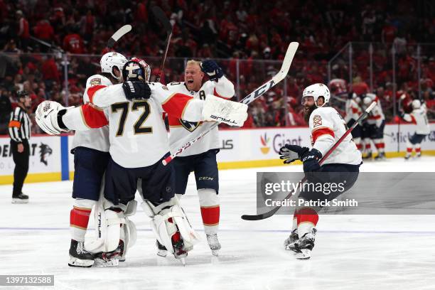 Goalie Sergei Bobrovsky of the Florida Panthers celebrates with teammates after the game-winning goal against the Washington Capitals during overtime...