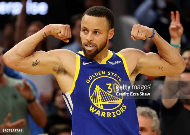 Stephen Curry of the Golden State Warriors flexes against the Memphis Grizzlies during the second quarter in Game Six of the 2022 NBA Playoffs...