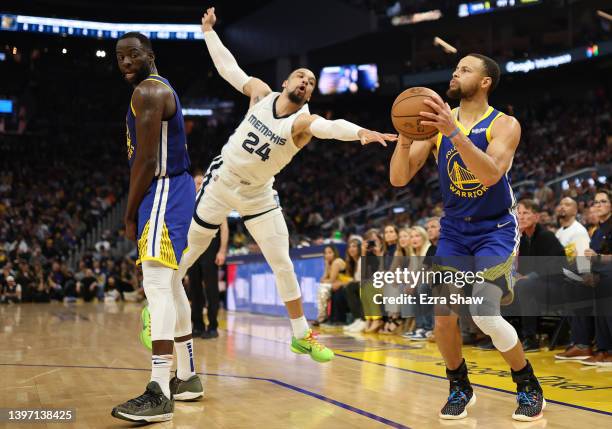 Stephen Curry of the Golden State Warriors takes a three-point shot against Dillon Brooks of the Memphis Grizzlies during the second quarter in Game...