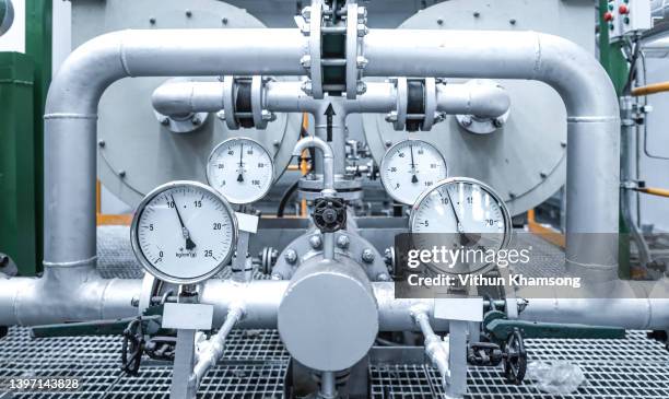 pressure gauge and pipe at industrial zone, steel pipelines and equipment, pipelines and insulation ,factory and power plant concept. - petroquimica imagens e fotografias de stock