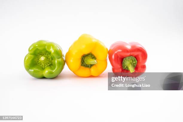 bell peppers on a white background - red pepper stock pictures, royalty-free photos & images