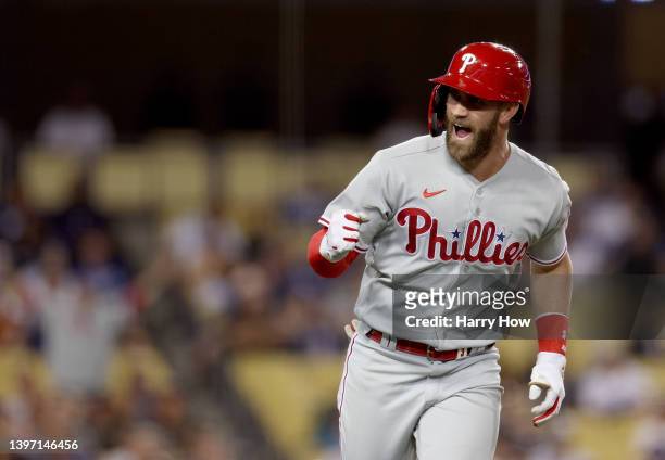 Bryce Harper of the Philadelphia Phillies celebrates his solo homerun to take a 9-7 lead over the Los Angeles Dodgers during the eighth inning at...