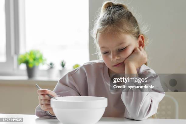 girl doesn't want to eat - picky eater stock pictures, royalty-free photos & images