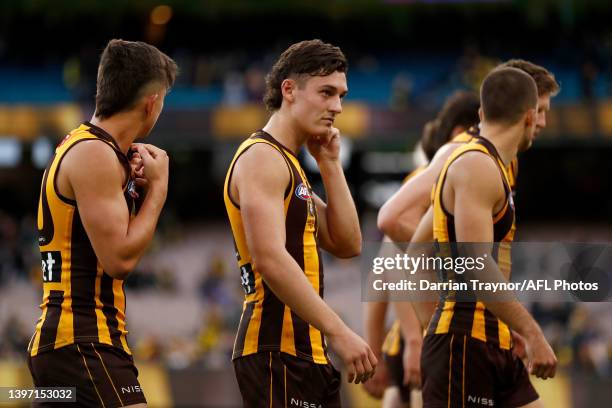 Dejected Hawthorn players walk from the ground after the round nine AFL match between the Hawthorn Hawks and the Richmond Tigers at Melbourne Cricket...