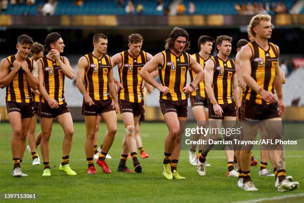 Dejected Hawthorn players walk from the ground after the round nine AFL match between the Hawthorn Hawks and the Richmond Tigers at Melbourne Cricket...