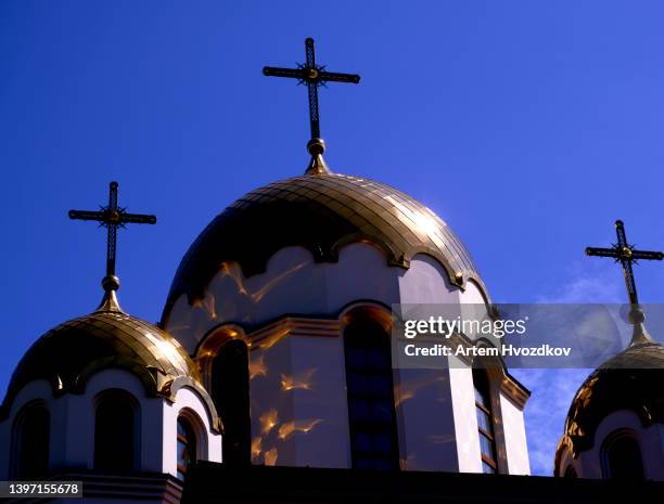 reflections of sin from golden metal cupola - orthodox stock pictures, royalty-free photos & images