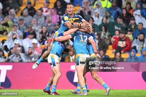 Beau Fermor of the Titans celebrates with team mates after scoring a try during the round 10 NRL match between the Gold Coast Titans and the St...