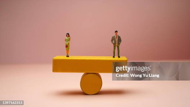 gender equality concept photo - gender-inequality-scale stock pictures, royalty-free photos & images