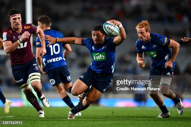 Caleb Clark of the Blues charges forward during the round 13 Super Rugby Pacific match between the Blues and the Queensland Reds at Eden Park on May...