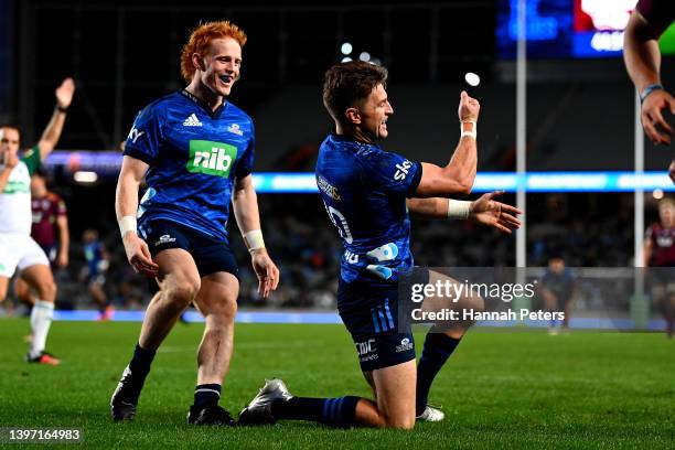 Beauden Barrett of the Blues celebrates after scoring a try during the round 13 Super Rugby Pacific match between the Blues and the Queensland Reds...