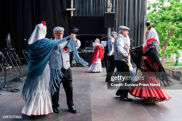 Several couples, dressed as chulapa and chulapo, dance a chotis, in an act of the Federacion Grupos Tradicionales madrileños during the San Isidro...