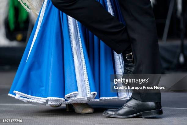 Couple, dressed as chulapa and chulapo, dance a chotis, in an act of the Federacion Grupos Tradicionales madrileños during the San Isidro...