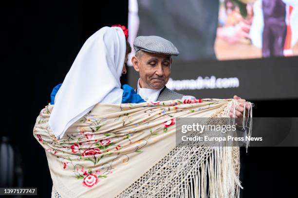 Couple, dressed as chulapa and chulapo, dance a chotis, in an act of the Federacion Grupos Tradicionales madrileños during the San Isidro...