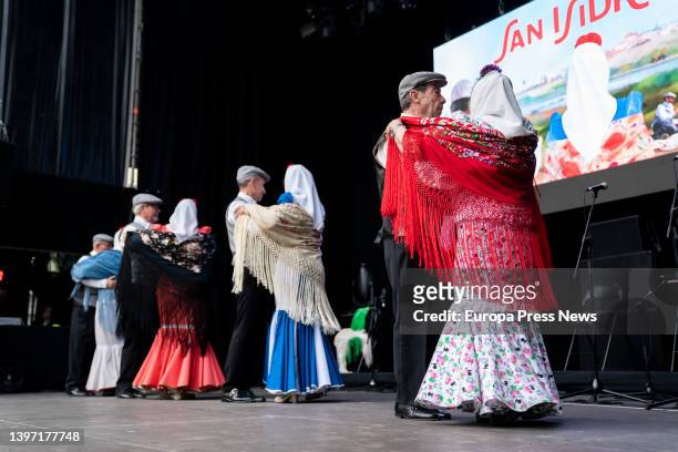 Several couples, dressed as chulapa and chulapo, dance a chotis, in an act of the Federacion Grupos Tradicionales madrileños during the San Isidro...