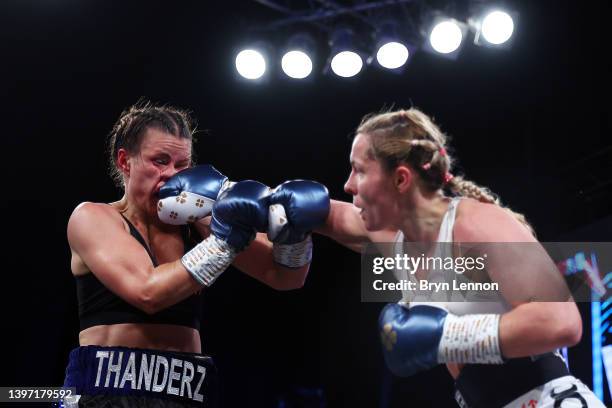 Tereza Dvorakova of The Czech Republic lands a punch on Katharina Thanderz of Norway during her Super Lightweight fight at Indigo at The O2 Arena on...