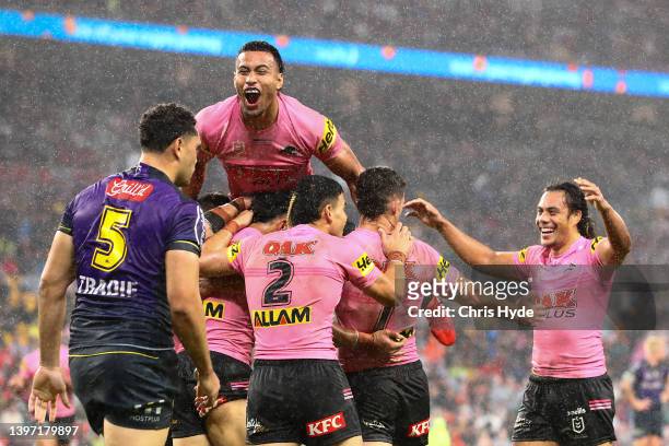 Panthers celebrate a try during the round 10 NRL match between the Melbourne Storm and the Penrith Panthers at Suncorp Stadium, on May 14 in...