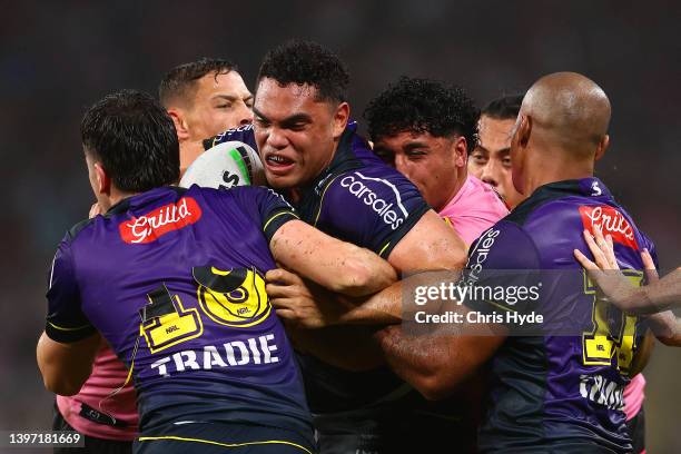 Xavier Coates of the Storm is tackled during the round 10 NRL match between the Melbourne Storm and the Penrith Panthers at Suncorp Stadium, on May...