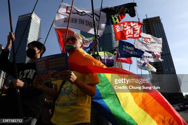 Supporters take part in a gathering ahead of the International Day Against Homophobia, Transphobia and Biphobia on May 14, 2022 in Seoul, South...