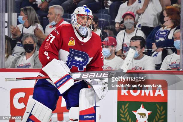 Goaltender Cayden Primeau of the Laval Rocket skates towards his net during the third period against the Syracuse Crunch in Game Three of the North...