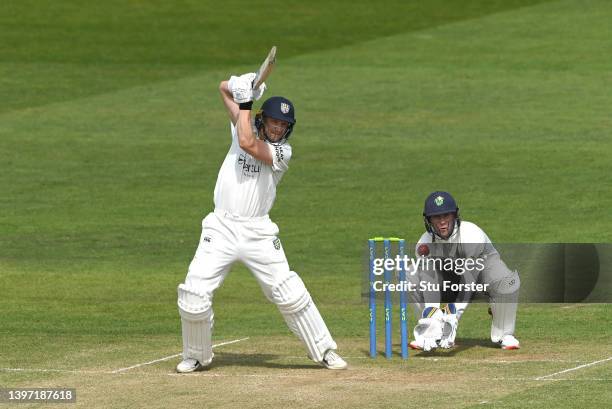 Durham batsman Scott Borthwick cuts a ball for runs watched by wicketkeeper Chris Cooke during the LV= Insurance County Championship match between...