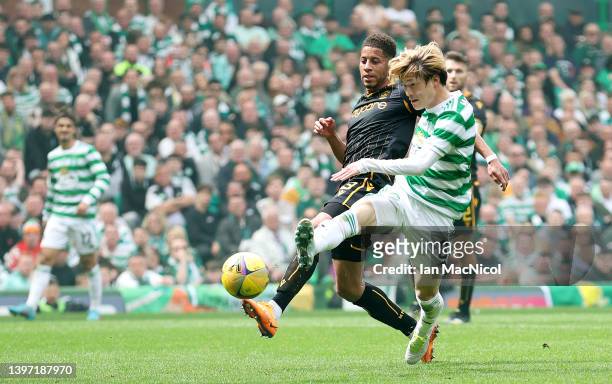 Kyogo Furuhashi of Celtic scores their side's third goal during the Cinch Scottish Premiership match between Celtic and Motherwell at Celtic Park on...