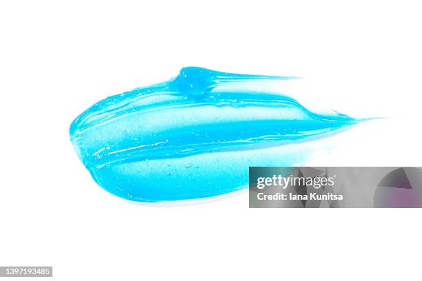 blue transparent smear of moisture serum for face on white background isolated. hydrating hyaluronic acid. antibacterial gel. cosmetic products for makeup and skin care. toothpaste. - zahnpasta stock-fotos und bilder