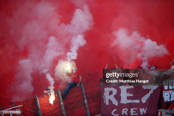 Koeln fans wave flares prior to the Bundesliga match between VfB Stuttgart and 1. FC Köln at Mercedes-Benz Arena on May 14, 2022 in Stuttgart,...