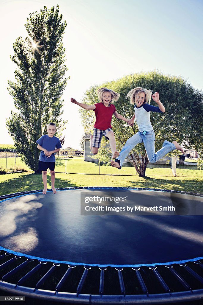 Kids jumping on trampoline