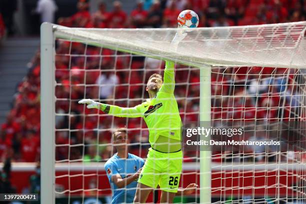 Mark Flekken of SC Freiburg taps the ball over the crossbar during the Bundesliga match between Bayer 04 Leverkusen and Sport-Club Freiburg at...