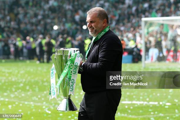 Angelos Postecoglou, Manager of Celtic lifts The Cinch Premiership trophy after their sides victory during the Cinch Scottish Premiership match...