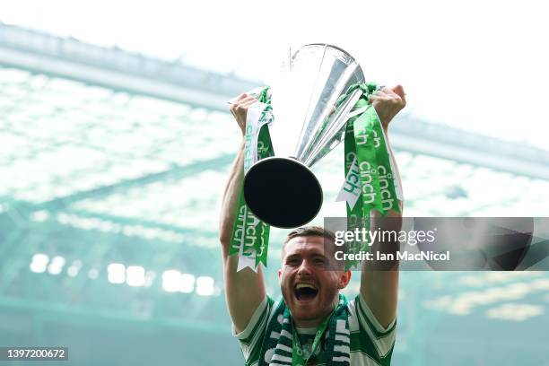 Anthony Ralston of Celtic celebrate with The Cinch Premiership trophy trophy after their sides victory during the Cinch Scottish Premiership match...