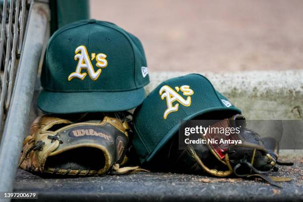 New Era Oakland Athletics hats and Wilson gloves and mitts are pictured during the game against the Detroit Tigers at Comerica Park on May 11, 2022...