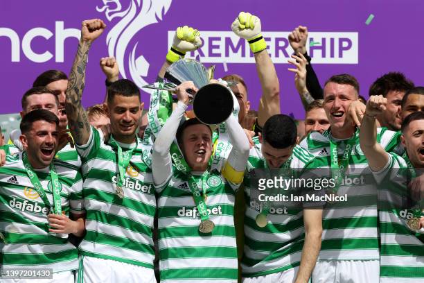 Callum McGregor of Celtic lifts The Cinch Premiership trophy after their sides victory during the Cinch Scottish Premiership match between Celtic and...