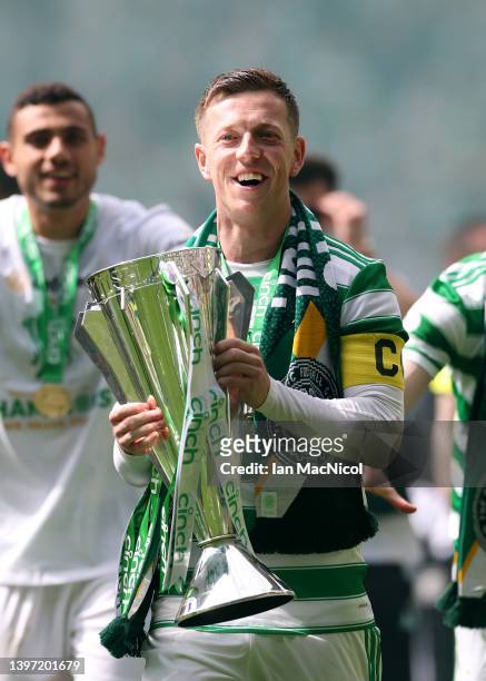 Callum McGregor of Celtic lifts The Cinch Premiership trophy after their sides victory during the Cinch Scottish Premiership match between Celtic and...