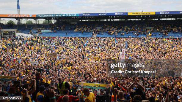 Fans of Braunschweig celebrate the rise to the Second Bundesliga after the 3. Liga match between Eintracht Braunschweig and Viktoria Köln at...