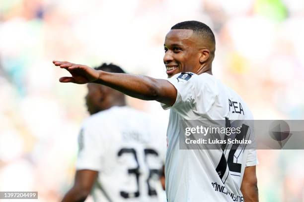 Alassane Plea of Borussia Monchengladbach celebrates after scoring their side's second goal from the penalty spot during the Bundesliga match between...