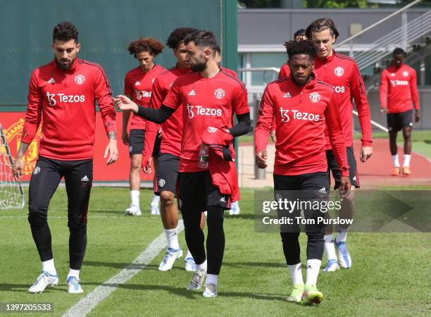 Alex Telles, Bruno Fernandes, Fred of Manchester United in action during a first team training session at Carrington Training Ground on May 12, 2022...