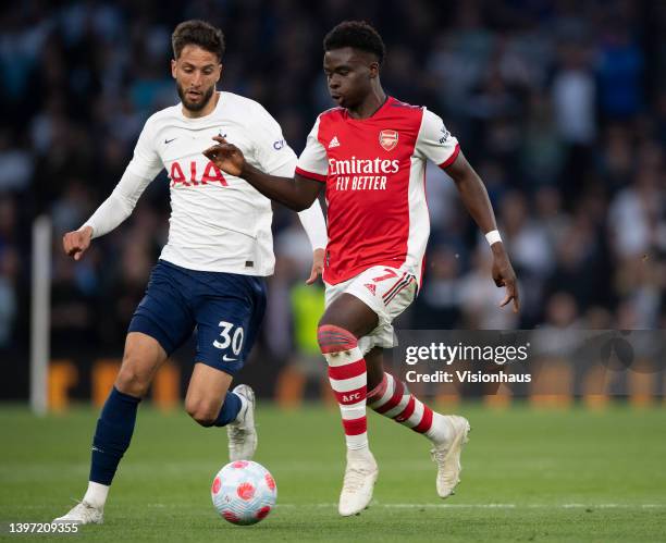 Bukayo Saka of Arsenal and Rodrigo Bentancur of Tottenham Hotspur during the Premier League match between Tottenham Hotspur and Arsenal at Tottenham...