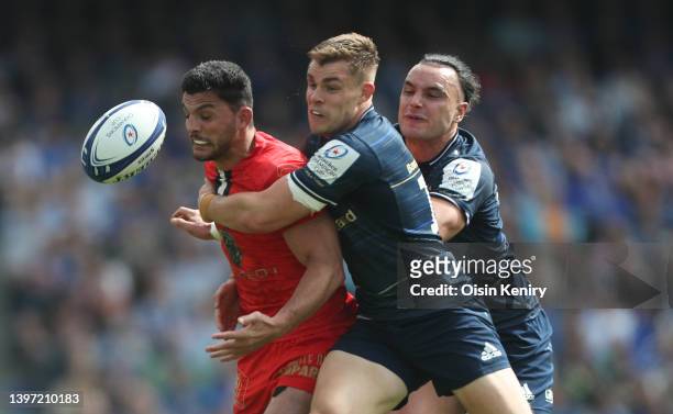 Pierre Fouyssac of Stade Toulousain is tackled by Garry Ringrose and James Lowe of Leinster during the Heineken Champions Cup Semi Final match...