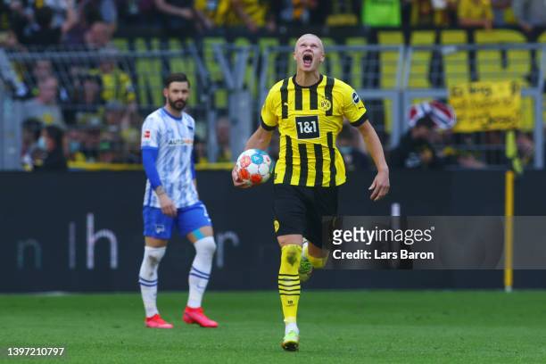 Erling Haaland of Borussia Dortmund celebrates after scoring their side's first goal from the penalty spot during the Bundesliga match between...