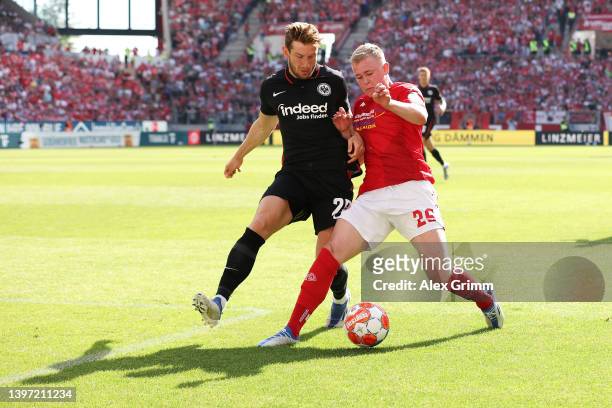 Christopher Lenz of Eintracht Frankfurt battles for possession with Jonathan Burkardt of 1.FSV Mainz 05 during the Bundesliga match between 1. FSV...